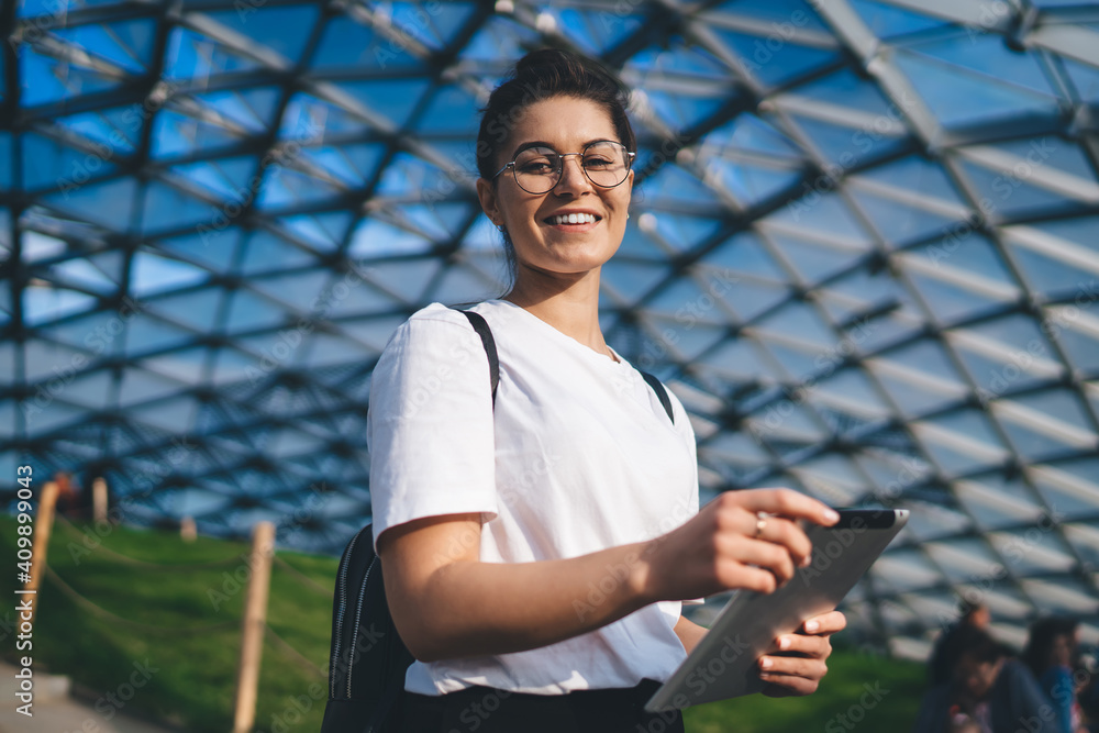 Aufkleber half length of cheerful female blogger using touch pad technology for networking during leisure in o