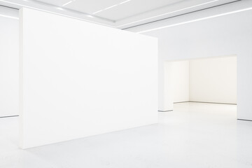 Spacious white gallery interior with empty exhibition stand. - obrazy, fototapety, plakaty