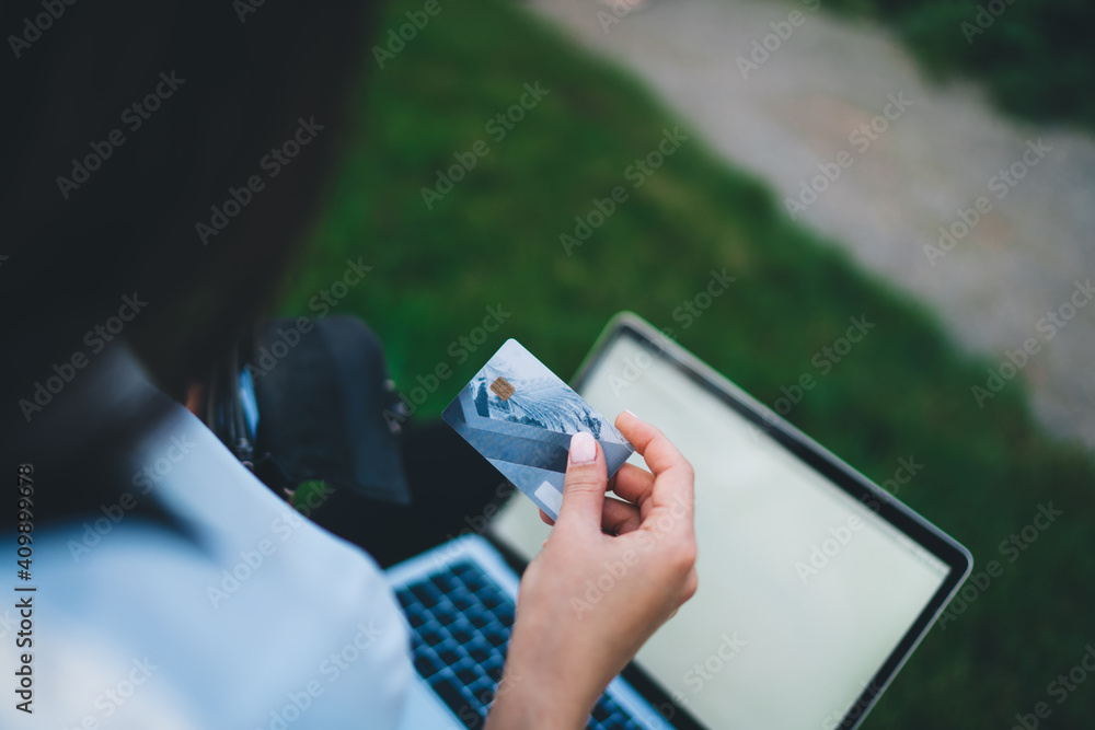 Poster cropped girl using credit card for making online shopping during cyber monday e commerce, skilled fe