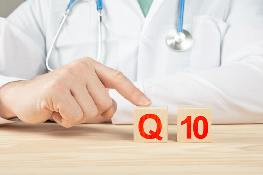coenzyme q10. essential vitamins and minerals for humans. q10 alphabet on wood cube. doctor recommends taking vitamin q10. doctor talks about the benefits of vitamin q10. q10 Vitamin - Health Concept.