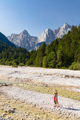 Children by the river near village Kranjska Gora in Triglav national park, Slovenia