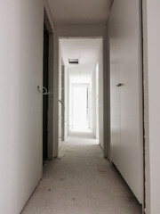 Floorless corridor of a house in a renovation work.