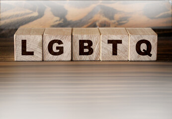 LGBTQ letters wooden cubes letters, on wooden background