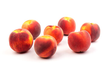 Summer fruit background. Ripe juicy peaches on white background. Copy space. Fresh organic fruit vegan food. Harvest concept