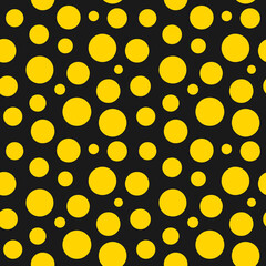 Yellow dots on black background seamless pattern.