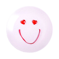 Cute smiling face made of decorative hearts and red ribbon on the plate isolated on white