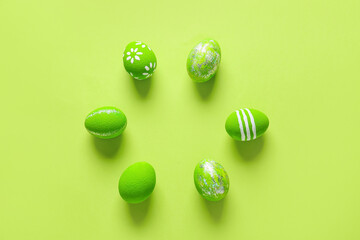 Composition with beautiful Easter eggs on color background
