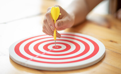 Fototapeta na wymiar Woman hand target on board,Business investment goal and target concept.