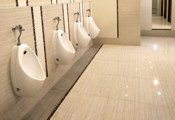 toilet men with row orderly urine bowls and luxury modern style, Interior and design resting room...