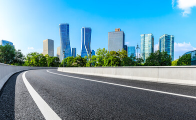 Empty asphalt road and modern city skyline with building in Hangzhou,China.