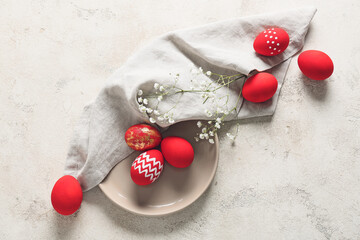 Composition with beautiful Easter eggs on light background