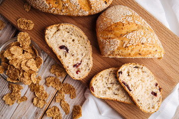 Top view on sliced muesli cereal bread on the wooden cutting board