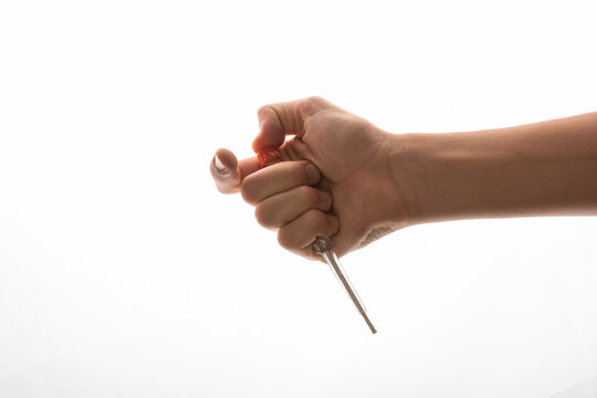 Hand Holding Circuit Tester Screwdriver On A White Background