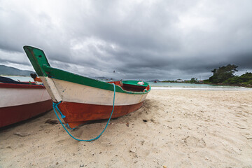 Boats on the beach on a cloudy day