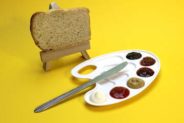 The palette includes mayonnaise, ketchup, mustard, jam and two types of jam with bread and a knife....