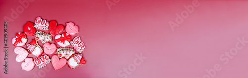 Banner with variation of different cookies for valentine's day. Heart, love and kiss cookie on pink background. Present gift or background for Valentine or Mother's day. Lovely sweet gift or postcard