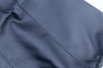 Close-up of a grey leather car seat cover for a car