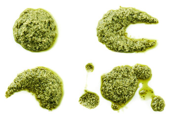 Set of brush strokes of green pesto sauce on white isolated background. Top view