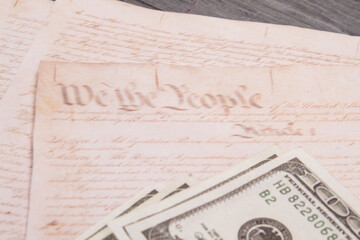Close-up old papers and dollars. Top view old handwriting and money.