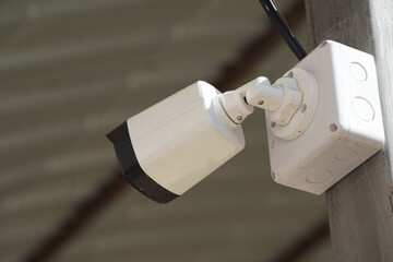 Dirty CCTV cameras are installed on the eaves for detecting property theft. CCTV security camera outdoors.