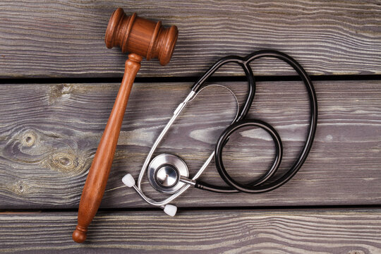 Gavel and stethoscope on wood. Medicine and court concept.