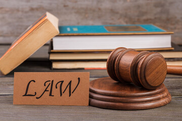 Justice and law concept. Wooden gavel and stack of books.