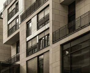 Modern commercial building of glass and metall cover panels photographed upward angle.