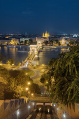 Fototapeta na wymiar Night cityscape of Budapest with the Chain bridge, St. Stephen's Basilica and castle hill cable car station