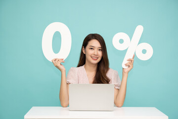Portrait of Asian business woman showing and holding 0% number or zero percent isolated over light...