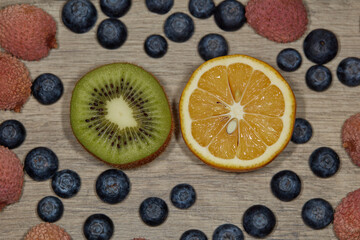 Green kiwi and yellow lemon blueberry lychee macro photography