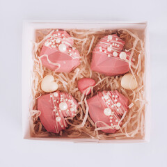 Pink heart-shaped cake in a box. Gift for Valentine's Day and Women's Day