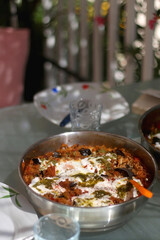 Quinoa and vegetable meal, served on the table outdoor. Selective focus.