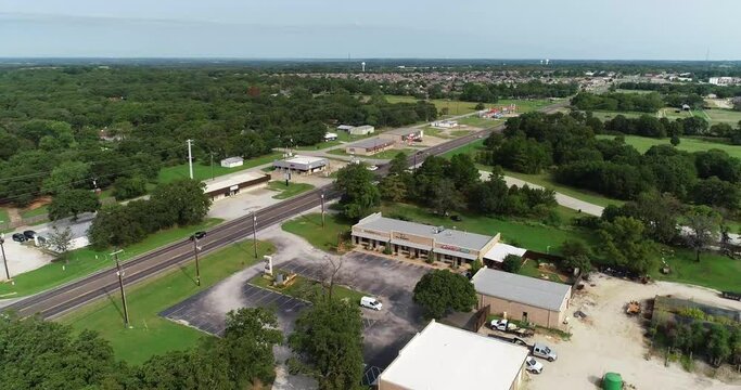 Aerial flight over the city of Krugerville in Texas. Audrey can be seen as the camera rises up.