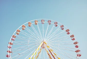 Deurstickers Picture of a Ferris wheel against the blue sky, retro colors toning applied. © MaciejBledowski