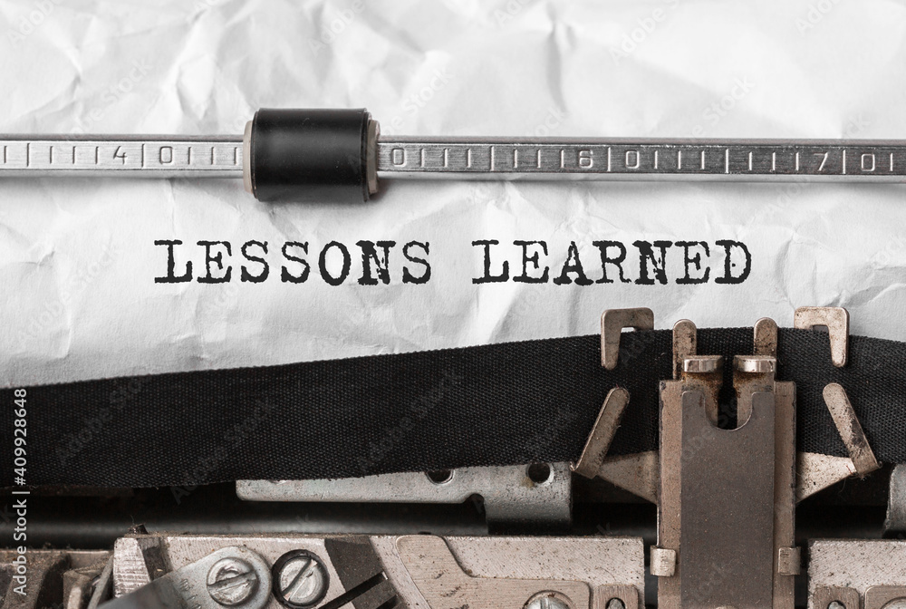 Poster text lessons learned typed on retro typewriter