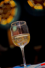 drink in glass glass on dark blurred background, vertical