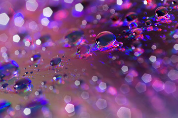 Purple water drops with bokeh
