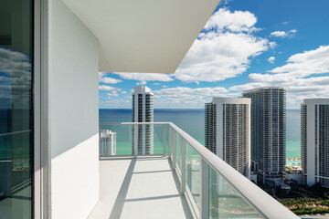 Luxury condo balcony with coastal ocean water view - obrazy, fototapety, plakaty