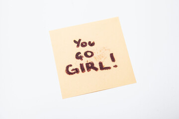 You go girl note on yellow sticky note pad, empowering women concept