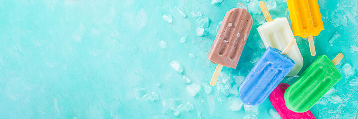 Selection of bright multicolored ice cream popsicle. Various gelato, frozen lollypops - chocolate...