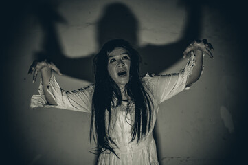 Portrait of asian woman make up ghost,Scary horror scene for background,Halloween festival...
