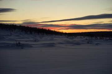 bright dawn in winter with large clouds