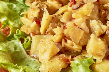 Baked vegetables: potato, zucchini, eggplant on plate. Vegetarian food