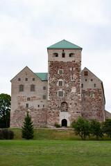 Fototapeta na wymiar Turku castle that is the largest surviving medieval building in Finland seen from the port of Turku