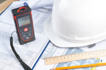 helmet and tools for construction drawings and construction drawings and laser rangefinder for...