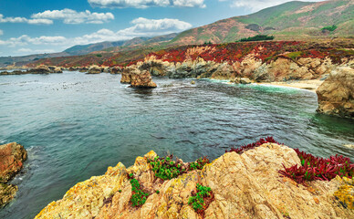 A beautiful view of a small cove in the Pacific Ocean, California, colorful landscape, bright sunny...