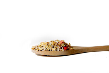 spoonful of granola isolated against white background. Healthy eting concept