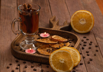 Naklejka premium tea with cinnamon and orange slices