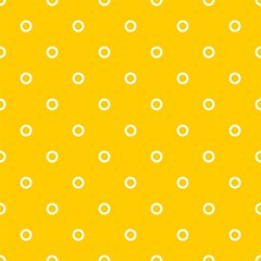 Seamless vector pattern with small white polka dots on a sunny yellow background