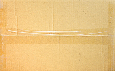 Brown paper box or Corrugated cardboard sheet with tape texture 